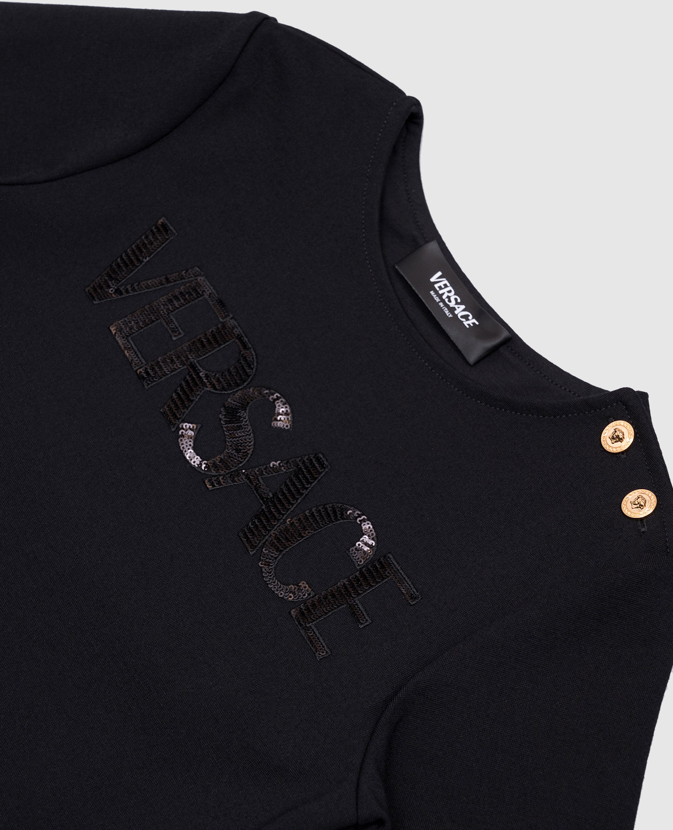 

Children's black dress with sequin logo Versace