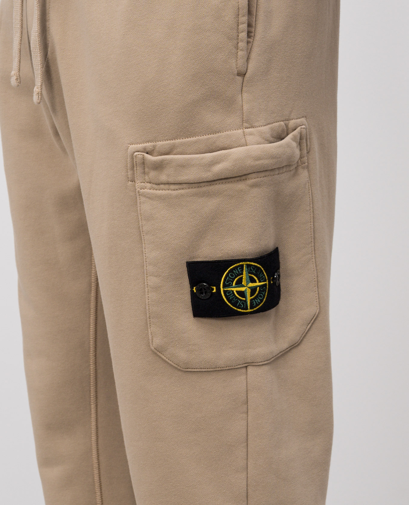 

Beige joggers with logo Stone Island