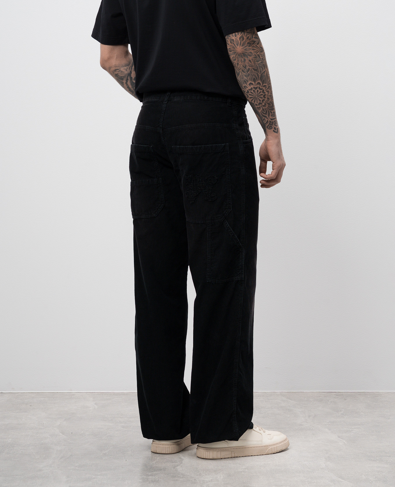 

Black corduroy pants with logo monogram Palm Angels