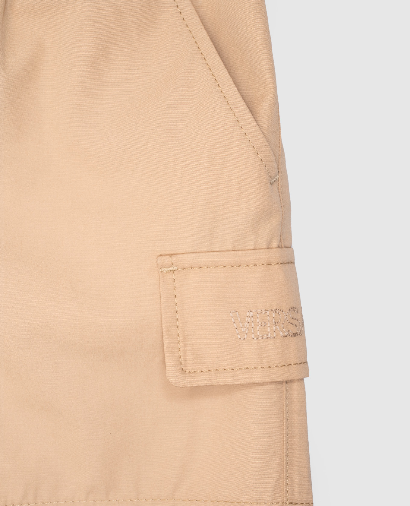 

Children's beige shorts with logo Versace