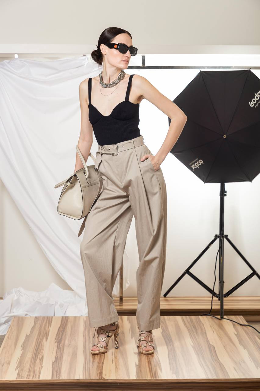 Slack trousers with pintucks and buckles on the legs CO 5