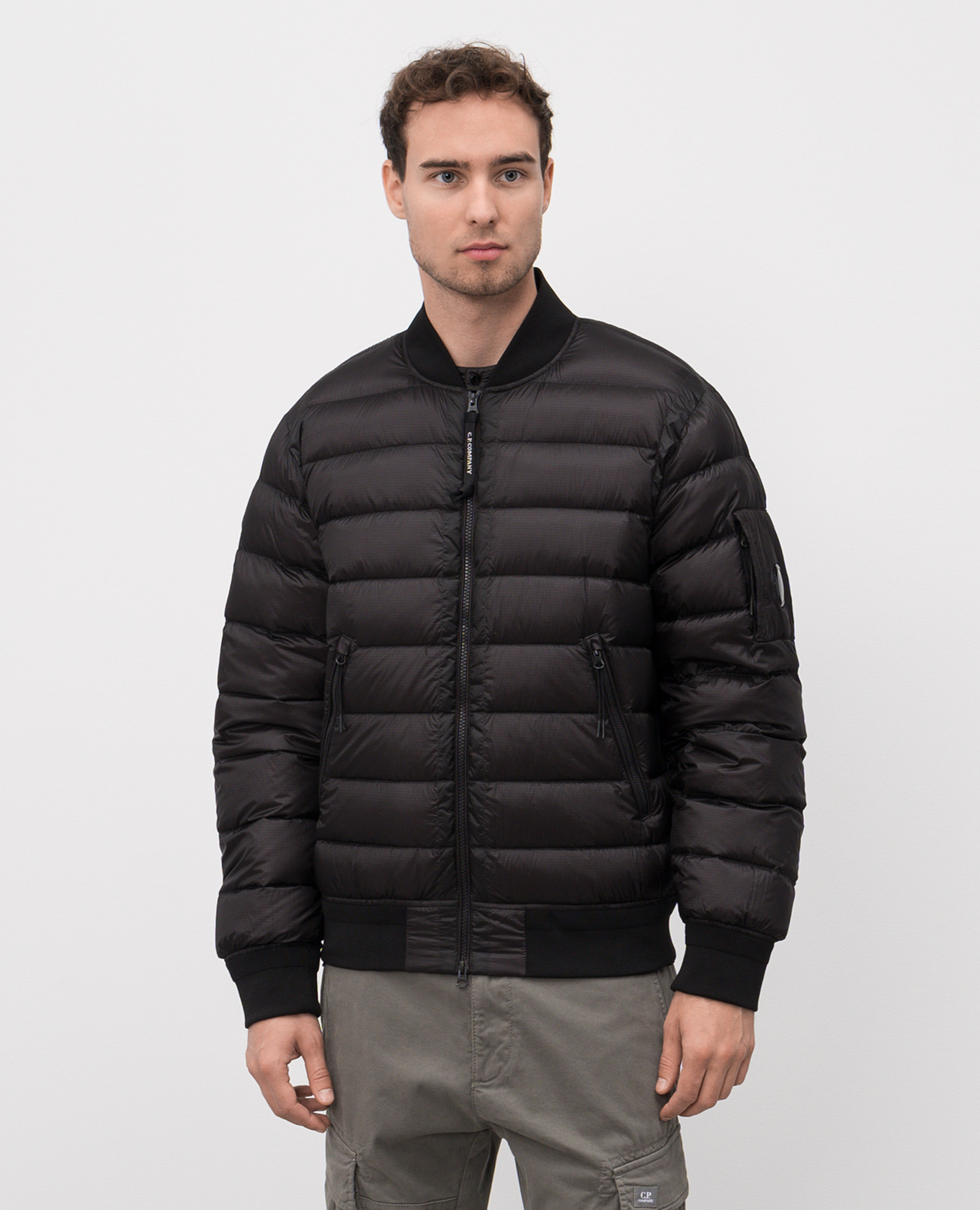 

Black down bomber jacket with logo C.P. Company