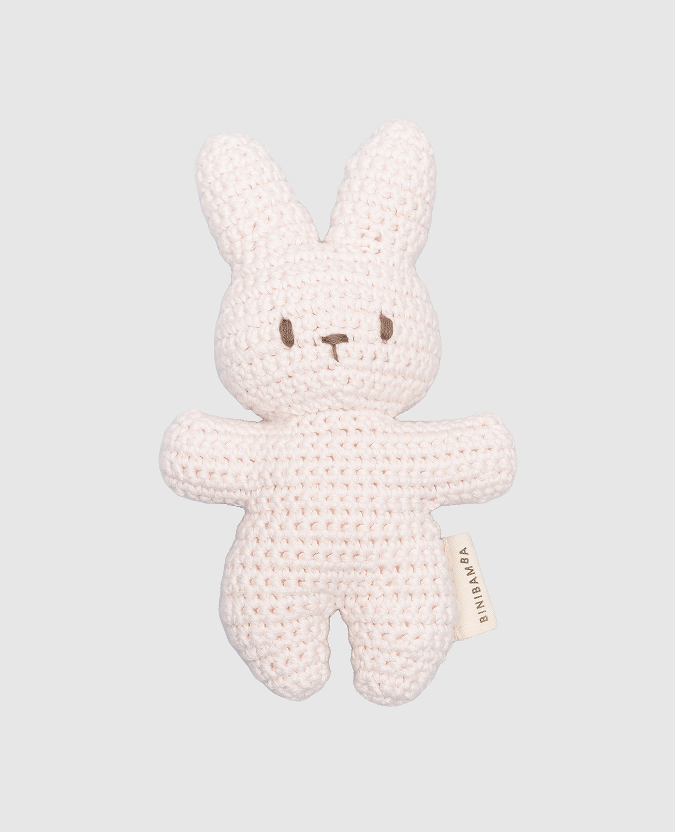 Children's pink knitted toy in the form of a bunny binibamba