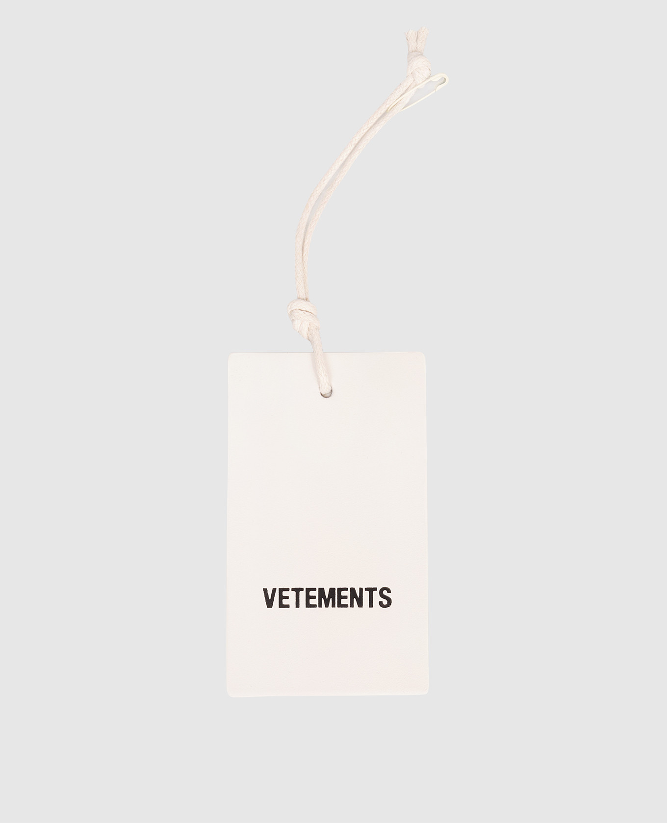 

White leather key chain in the form of a tag Vetements