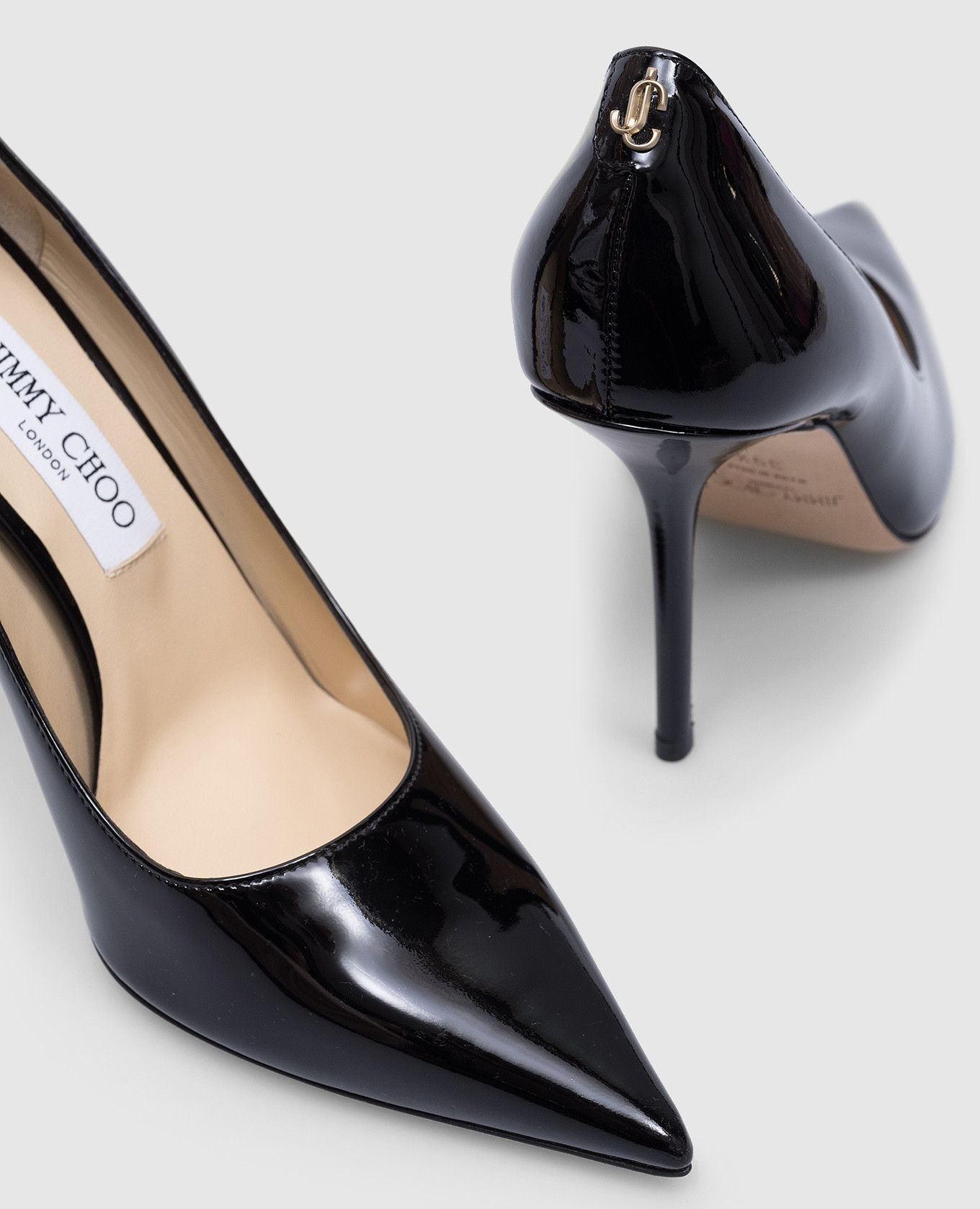 

Love black patent leather shoes with metallic JC logo Jimmy Choo