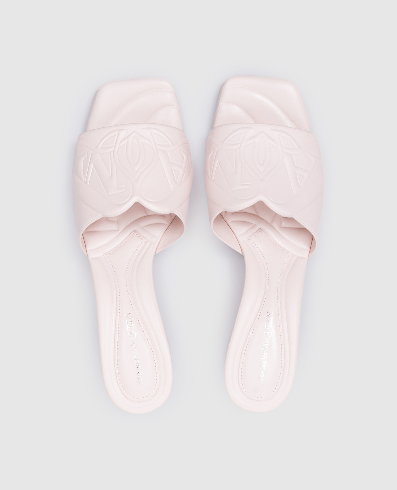 

Seal logo embossed mules in pink leather Alexander McQueen