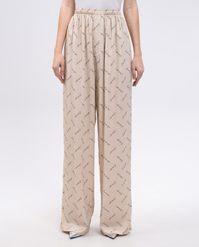 Balenciaga Beige pants with logo print 814016TRLB1