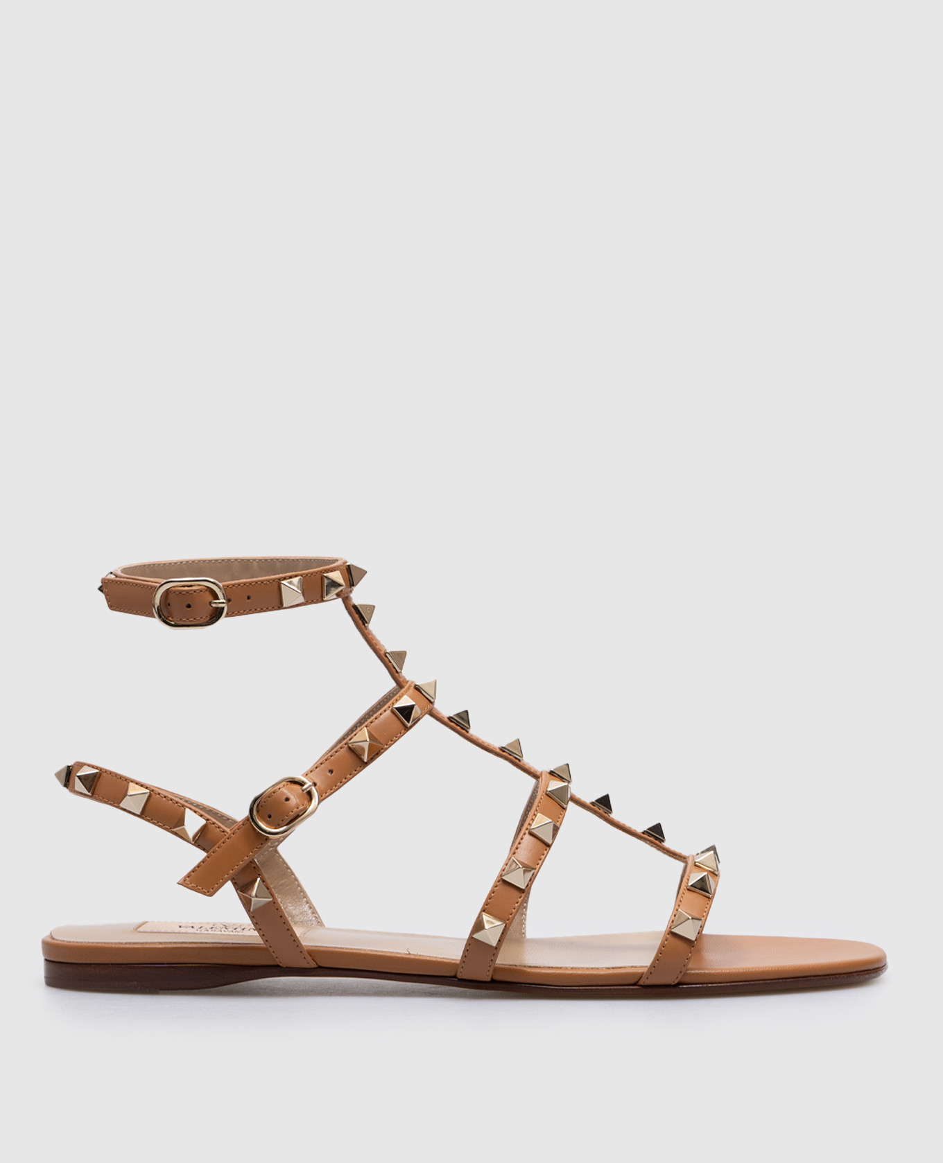 Brown leather sandals with pyramids rockstud valentino