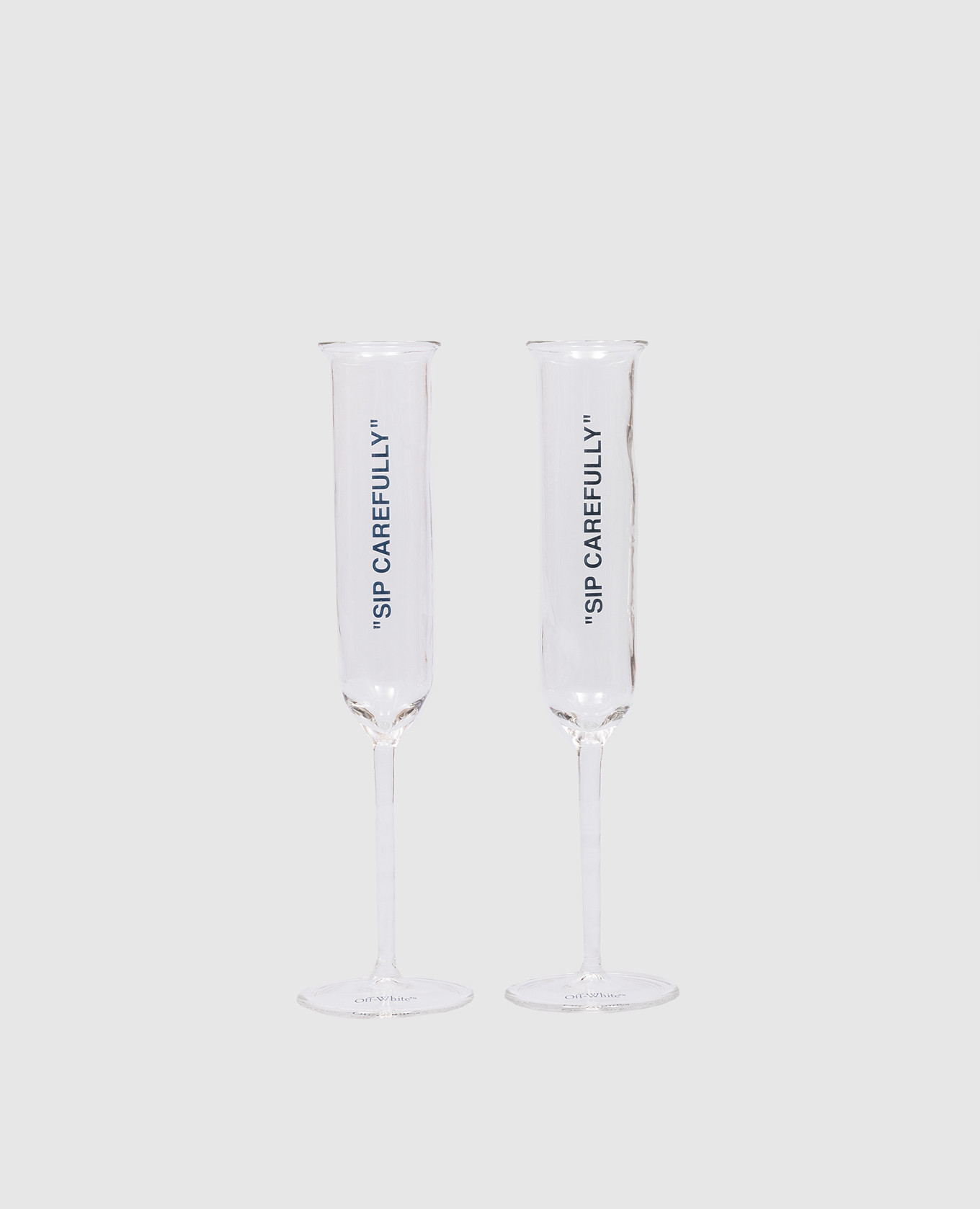 

A set of glasses with the inscription Sip Carefully Off-White, Transparent