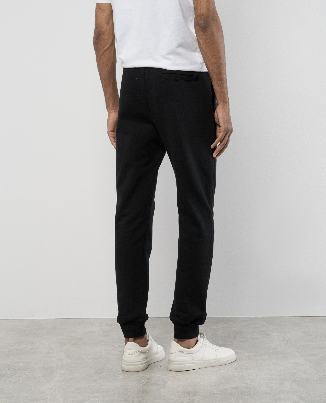 Black joggers with textured logo print Versace 4