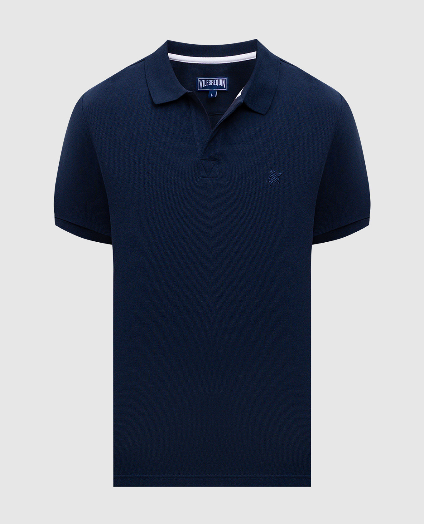 Blue polo with embroidered logo emblem