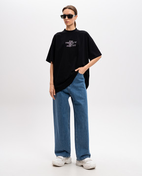 Vetements Blue jeans with logo patch UA66PA540Nw