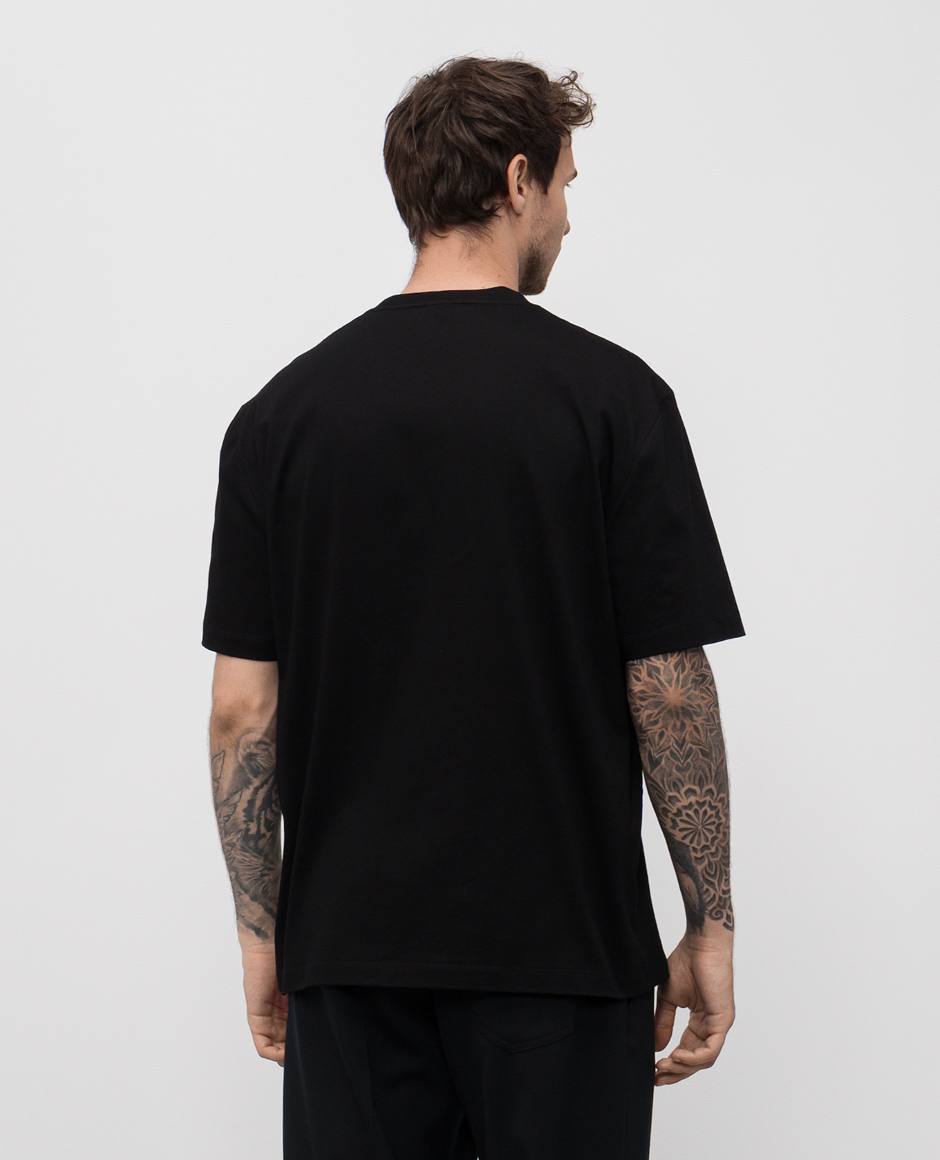 

Black T-shirt with logo emblem print Versace