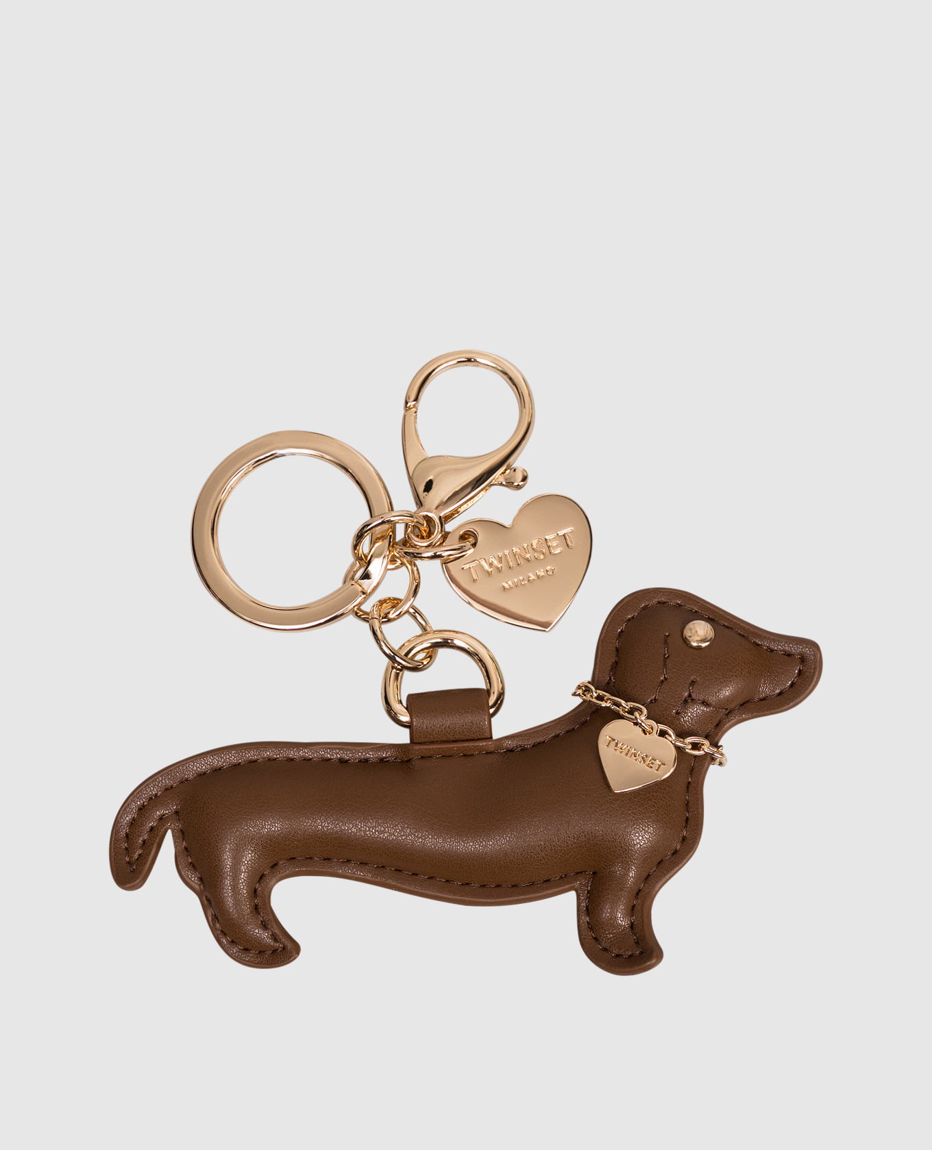 

Brown dog-shaped keychain with emblem Twinset