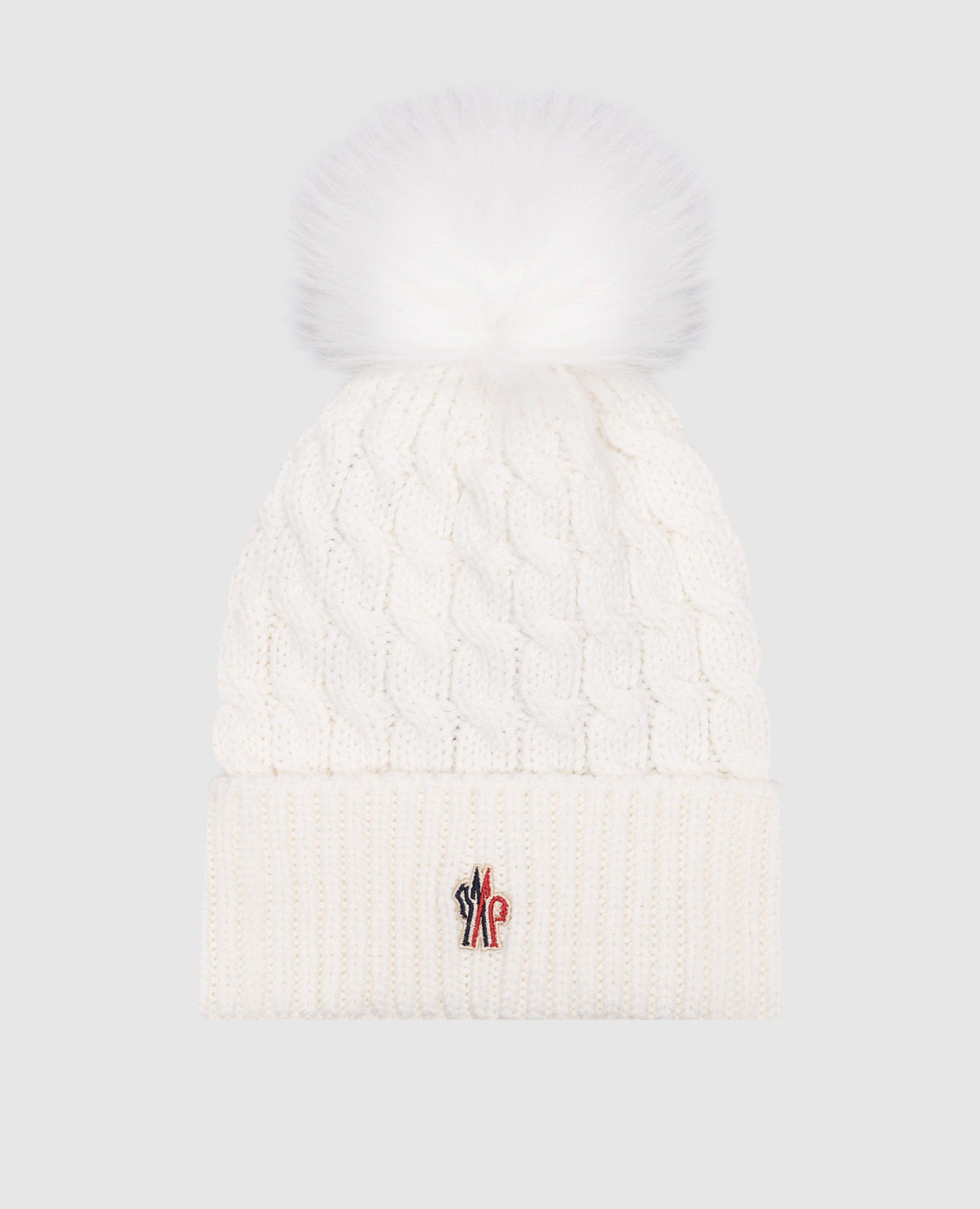 A white wool hat with a fur pom-pom moncler grenoble