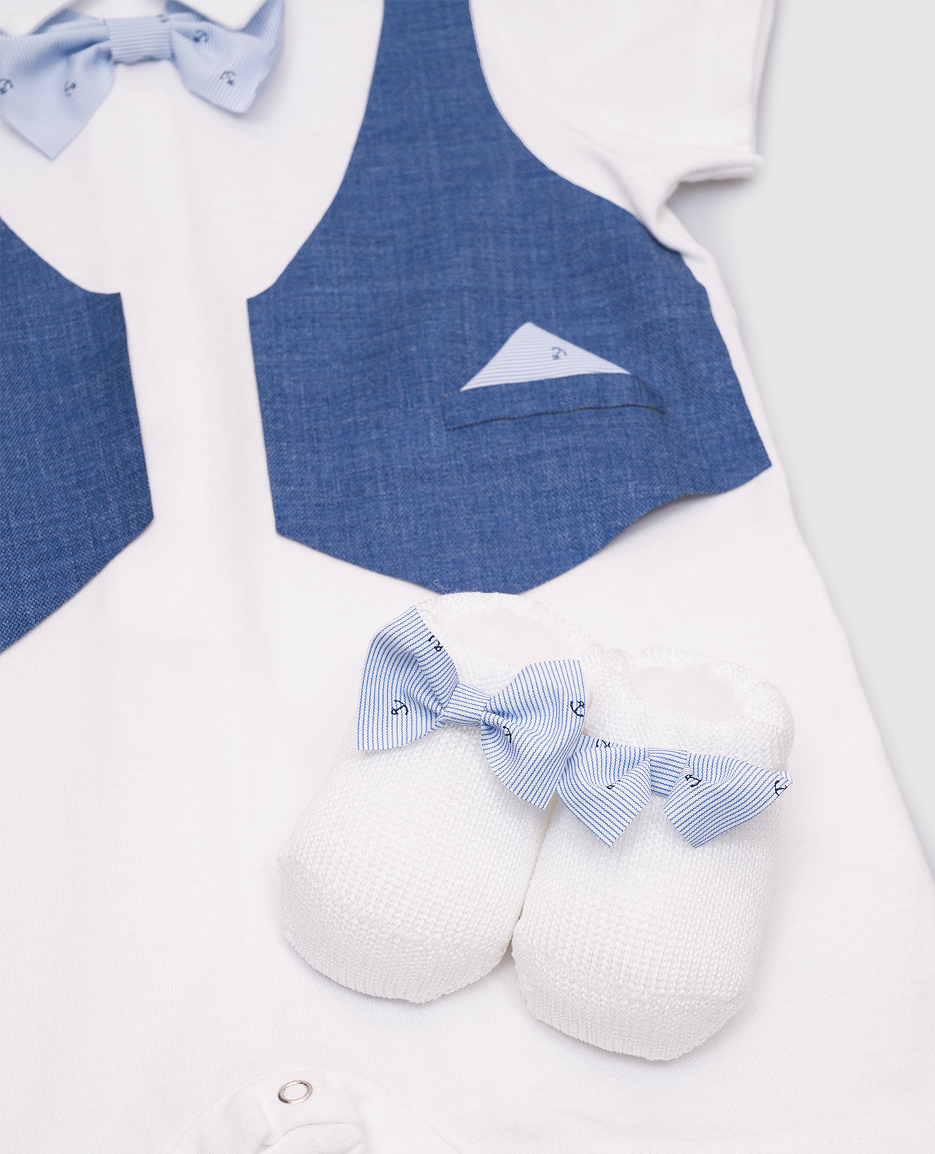 

Baby white bodysuit and booties set Story Loris