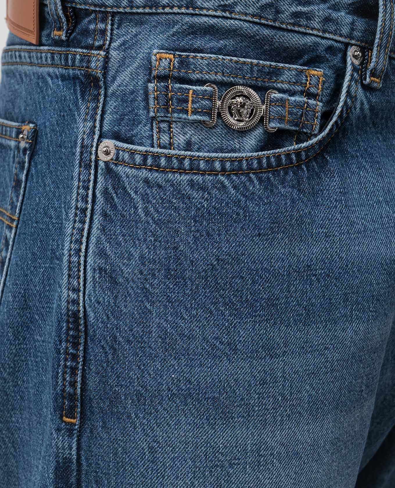 

Blue jeans with leather logo patch Versace
