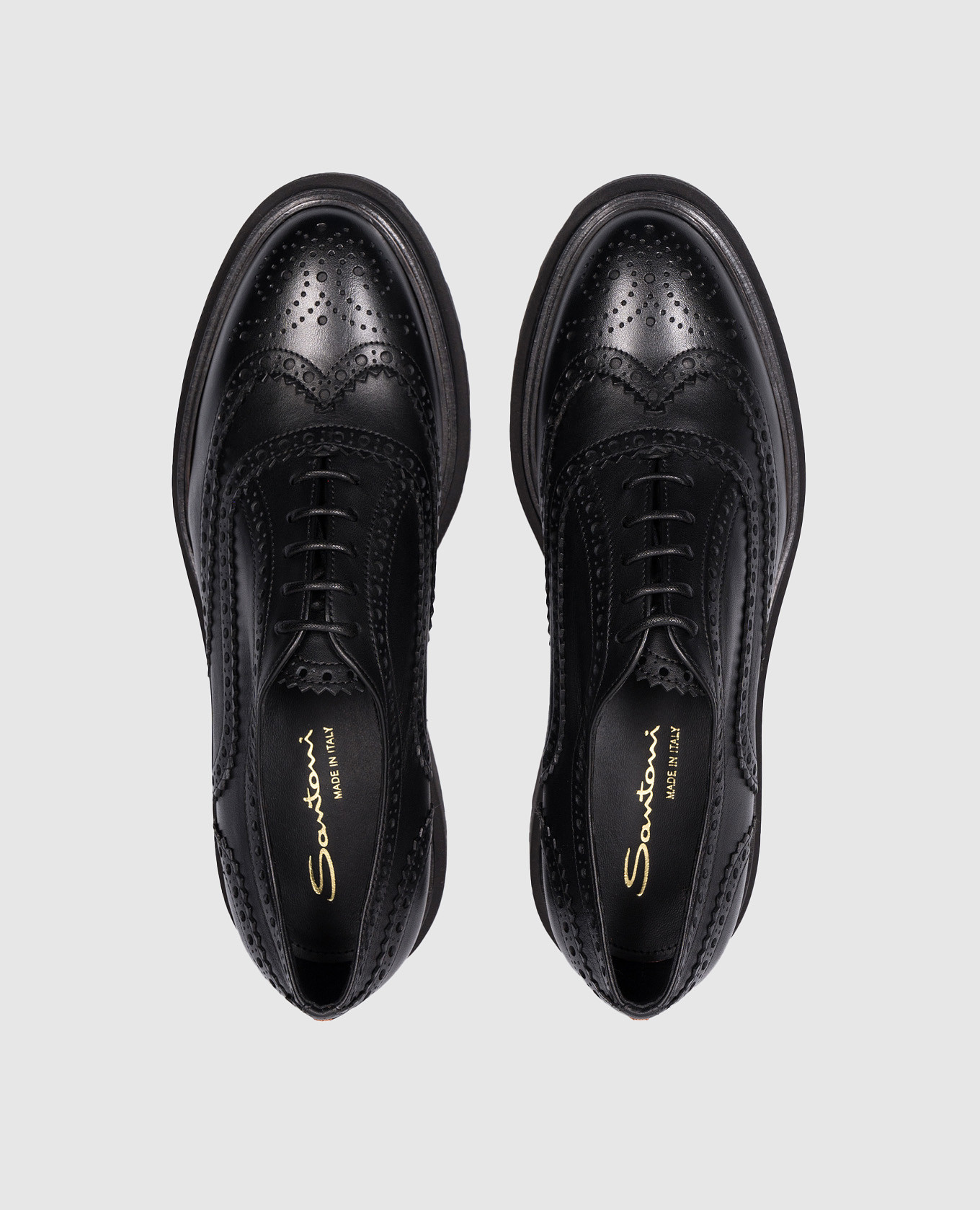 

Black leather brogues with perforations Santoni