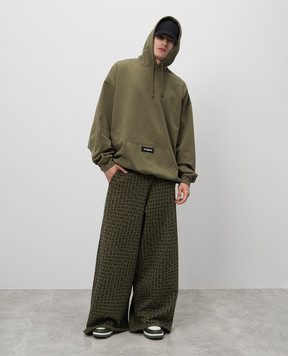 Vetements Green sweatpants in logo pattern UA65SP150K