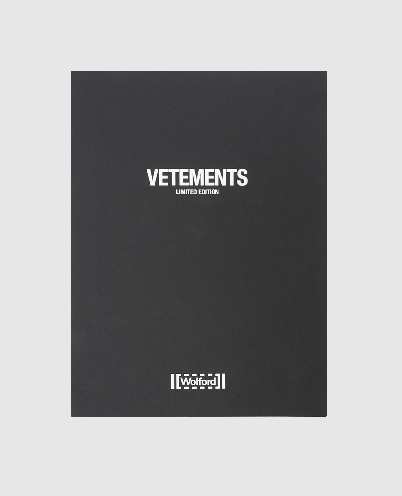 

Black tights in a logo pattern collaboration with Wolford Vetements