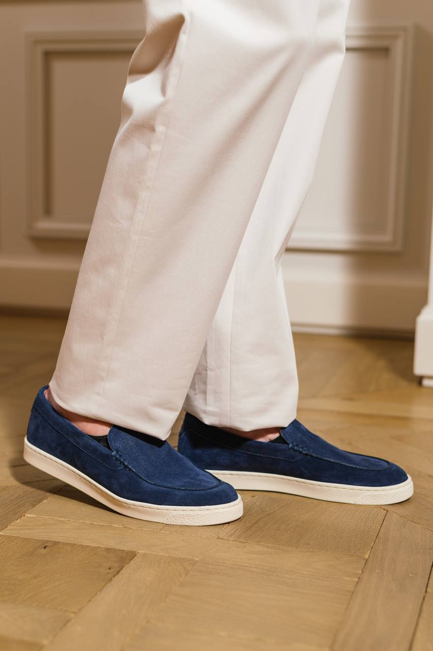 

Blue suede slip-ons in a pattern with a logo emblem print Brunello Cucinelli
