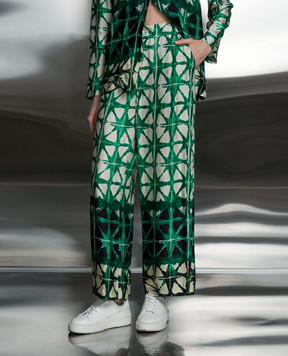 Solotre Green pants in a branded pattern M1B0089
