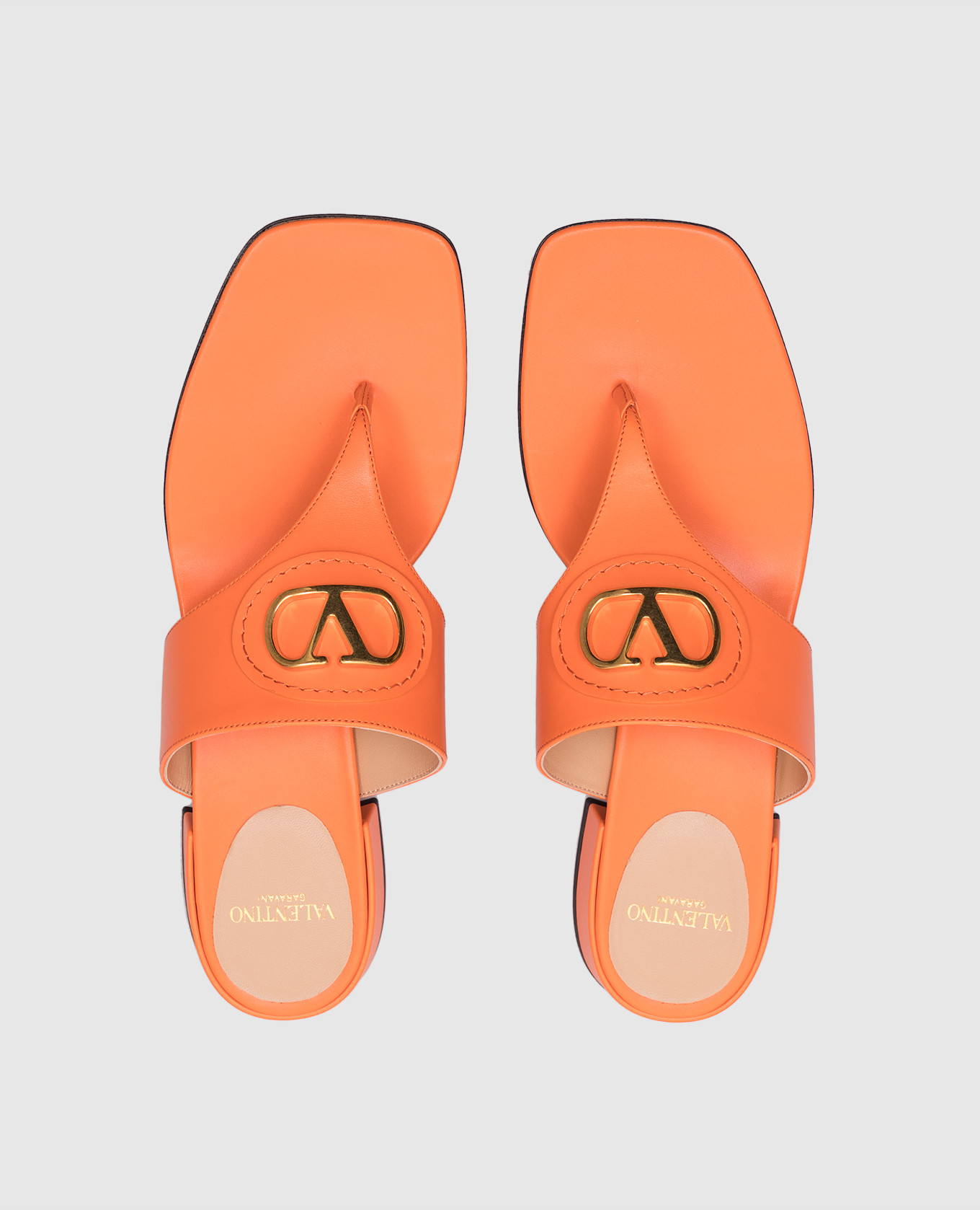 

Orange leather flip-flops with logo Valentino