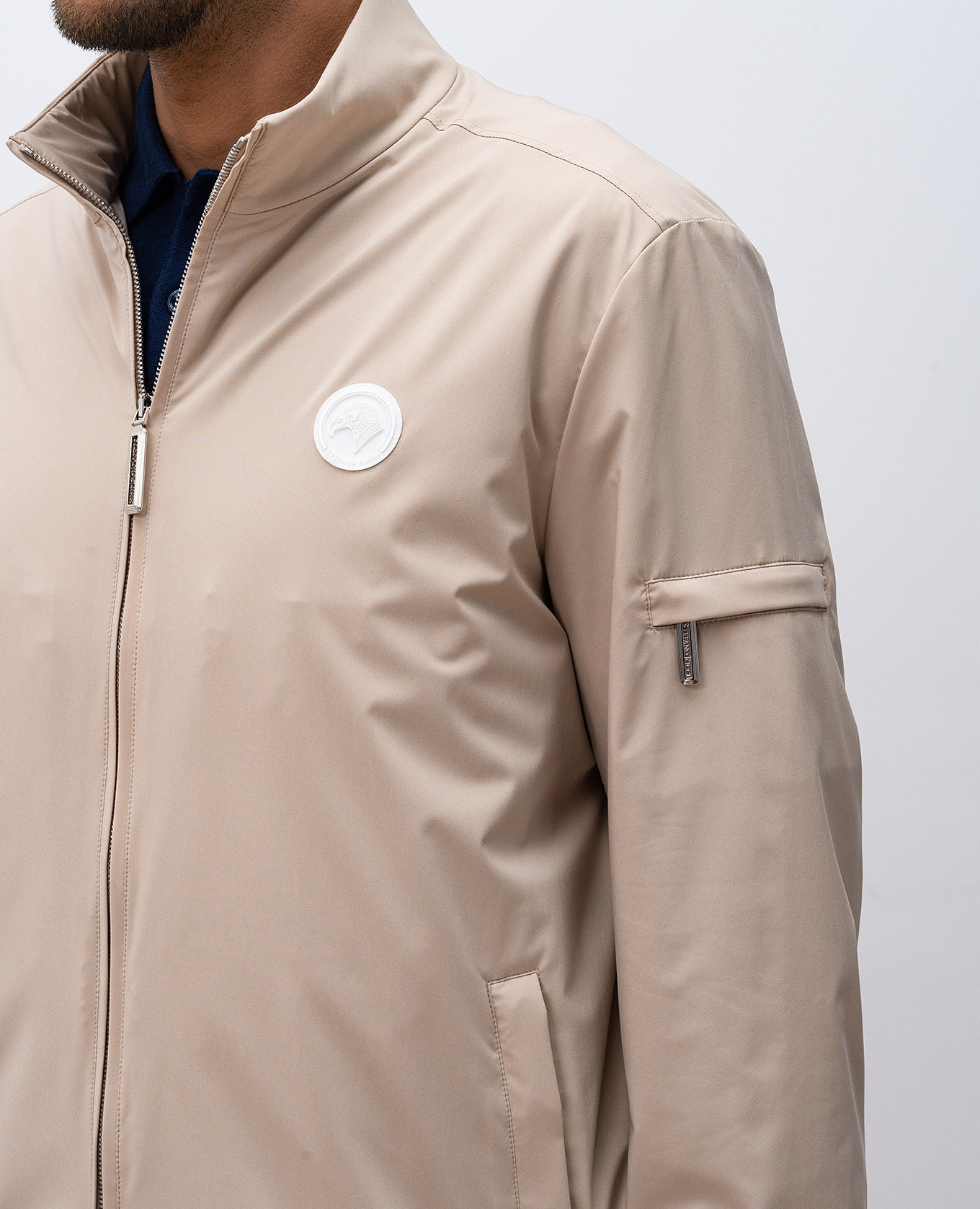 

Beige windbreaker with emblem patch Stefano Ricci