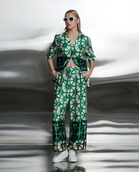 Solotre Green pants in a branded pattern M1B0089