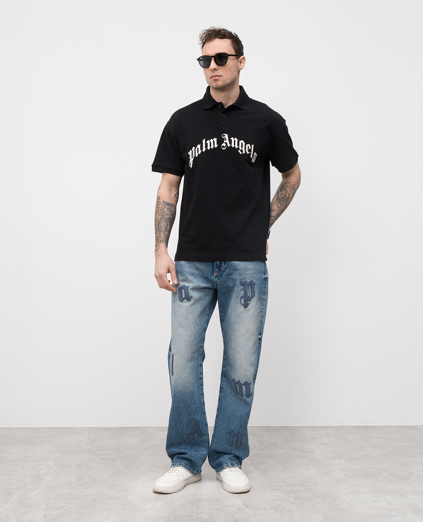

Blue jeans with suede logo appliqué Palm Angels