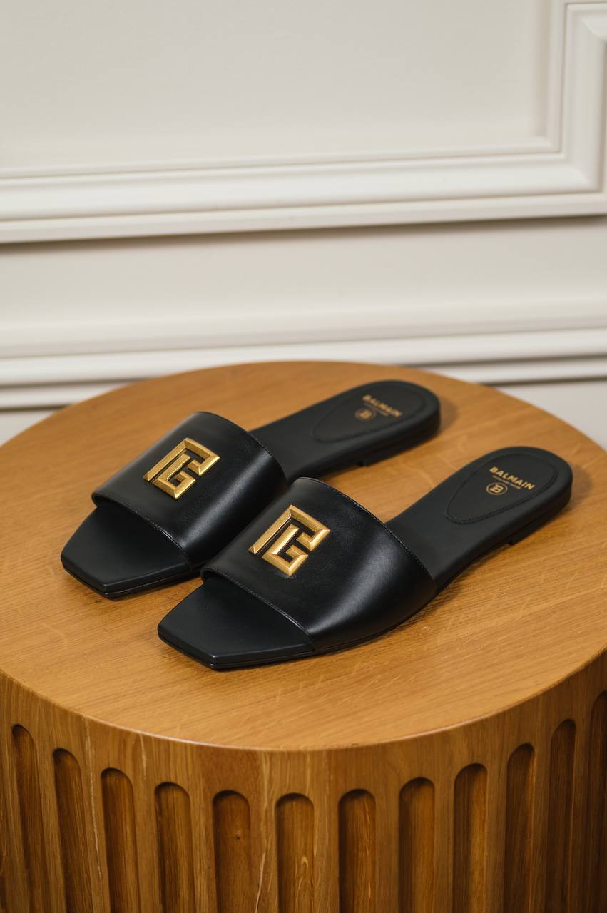 

Dafne PB logo flip flops in black leather Balmain