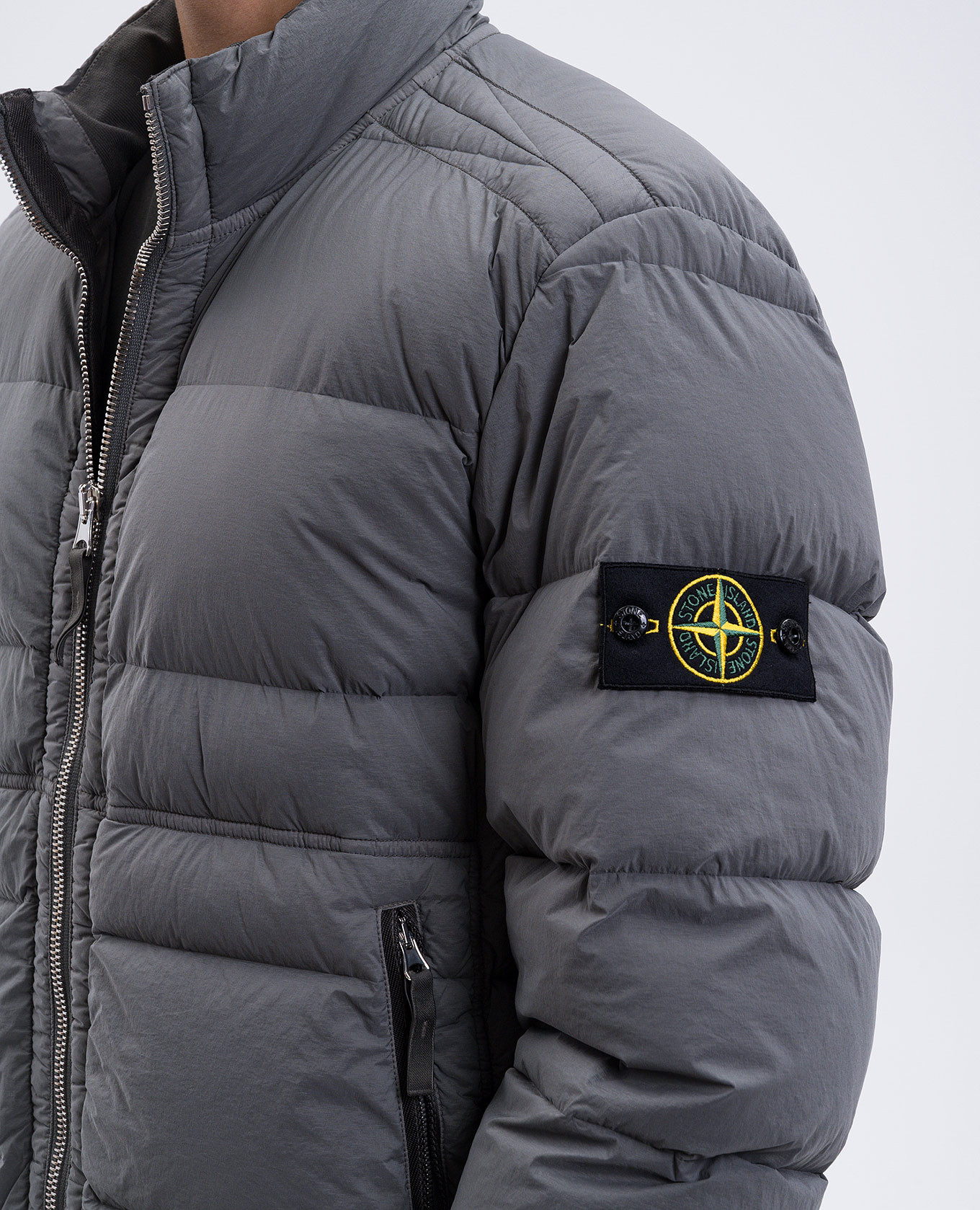 

Green down jacket with logo Stone Island