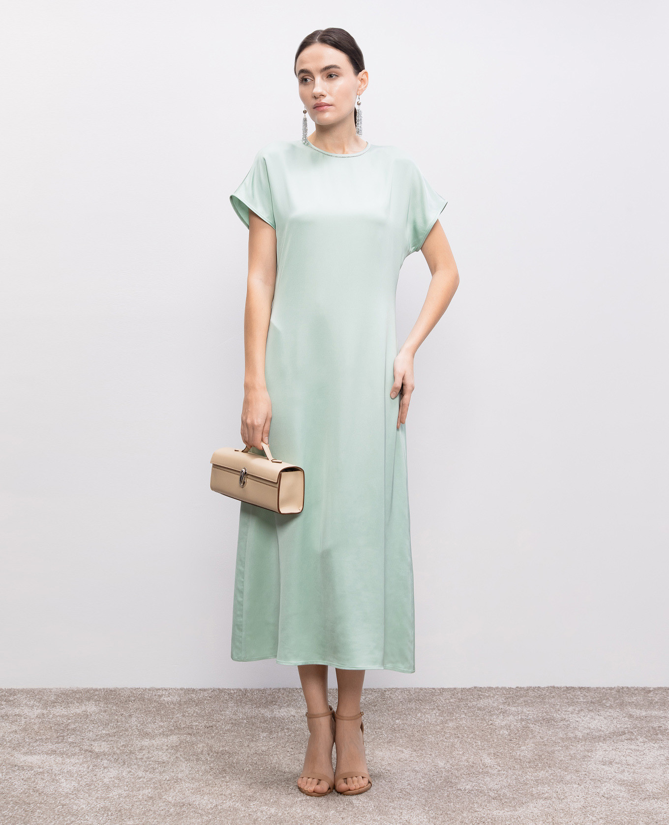 

Green dress with a monil chain Peserico