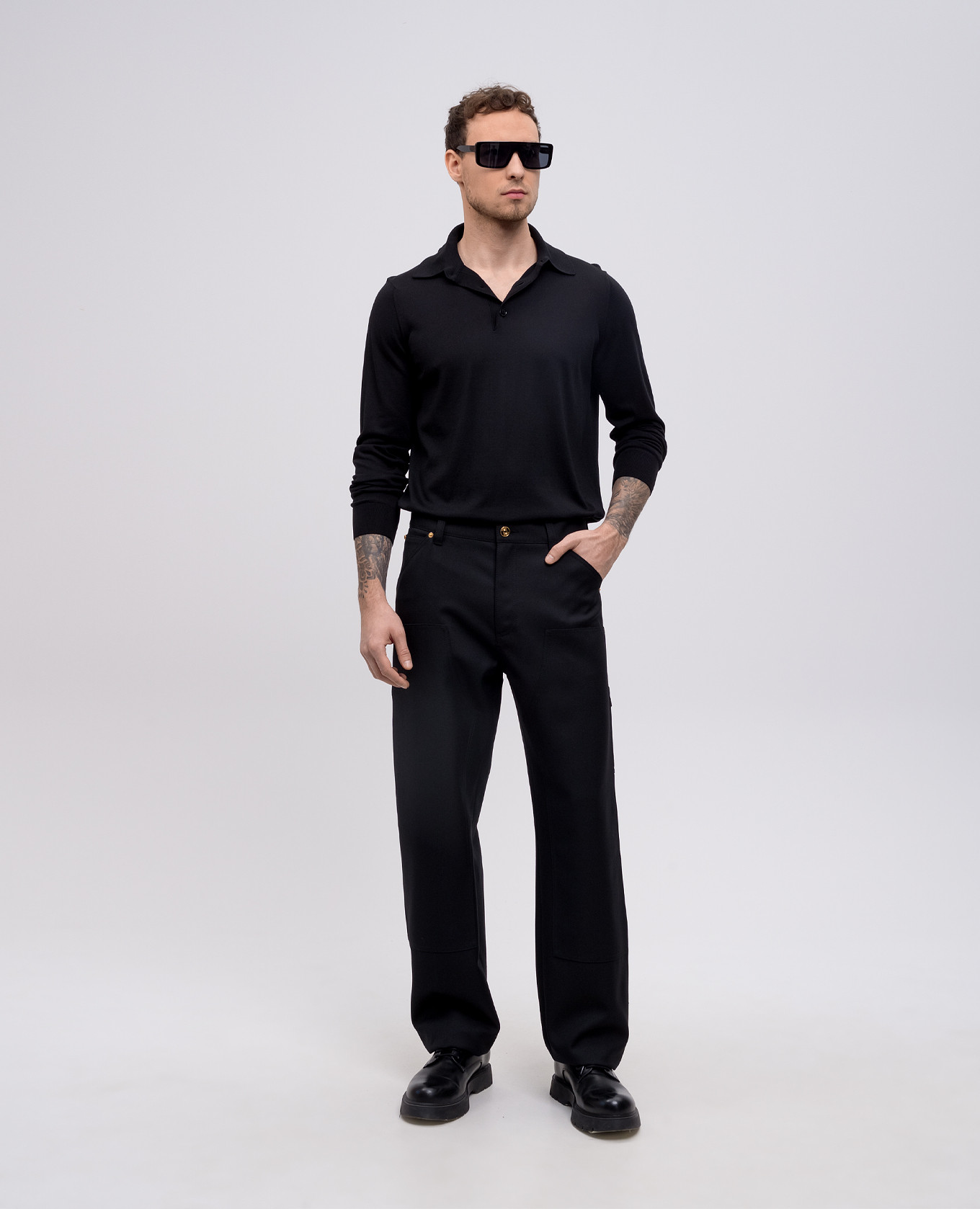 Black wool trousers with leather logo patch Versace 2