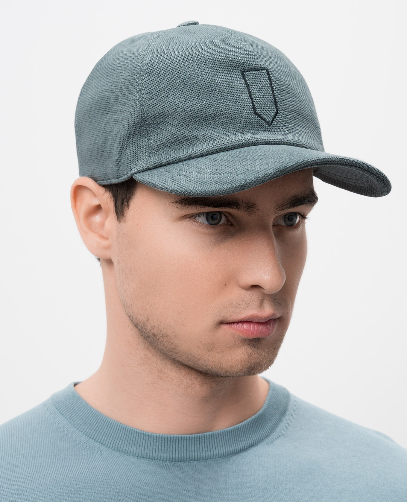 

Green cap with embroidery Canali