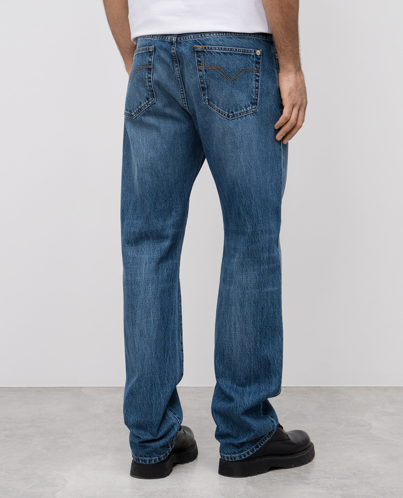 Blue jeans with leather logo patch Versace 4